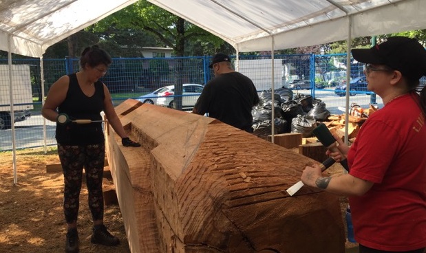 Carving begins on the cedar log
