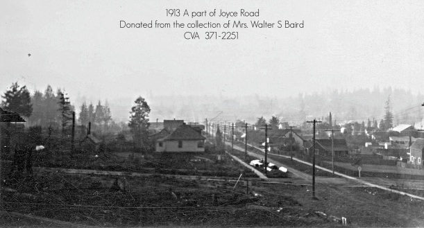 1913 Joyce Road and Wellington photo from Mrs. Walter S. Baird. The Joyce garage was built on the lower right corner beside the dark brown house, facing Joyce, which is shown looking south up the hill.